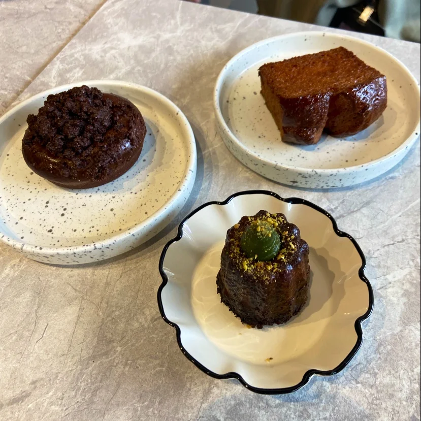 A Fiorise canelé with pistachio garnish