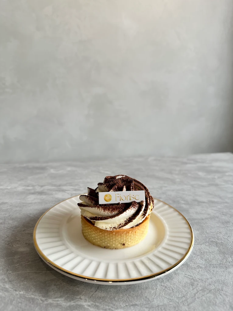 Fiorise chocolate tart on a fluted plate