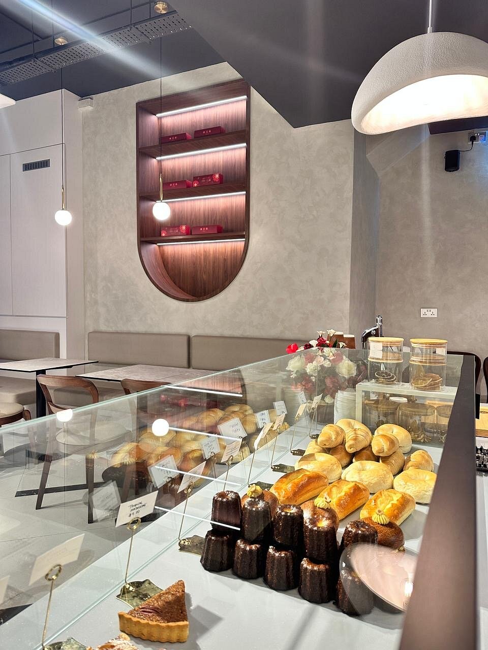 Canelés, rolls and pastries in Fiorise's display counter