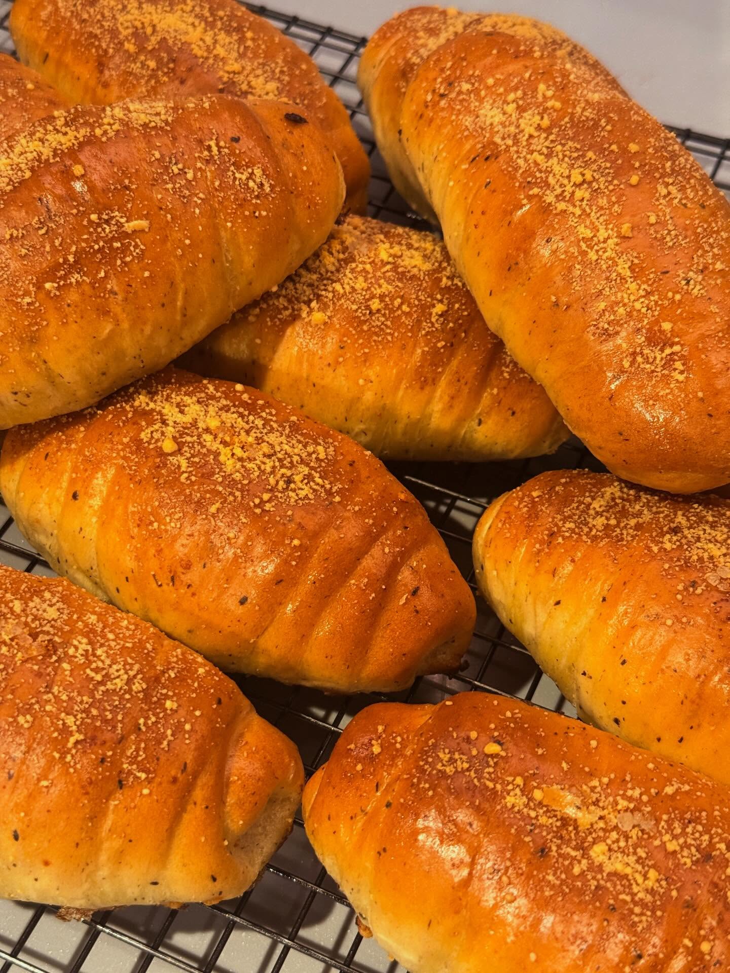 Golden Fiorise bread rolls cooling on a rack