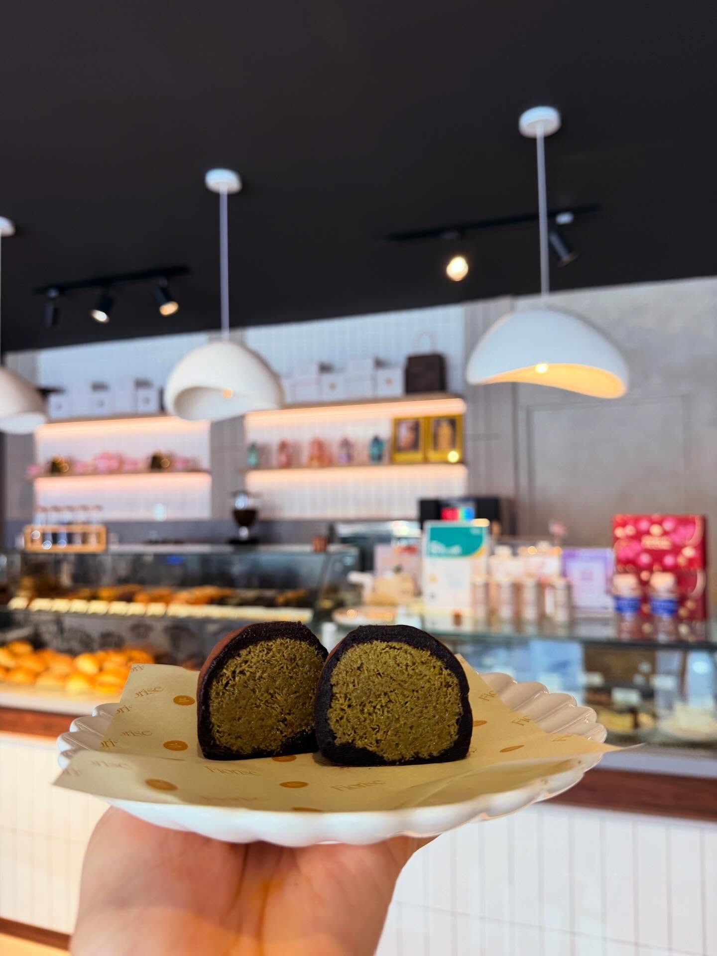 A matcha-filled chocolate roll presented inside Fiorise
